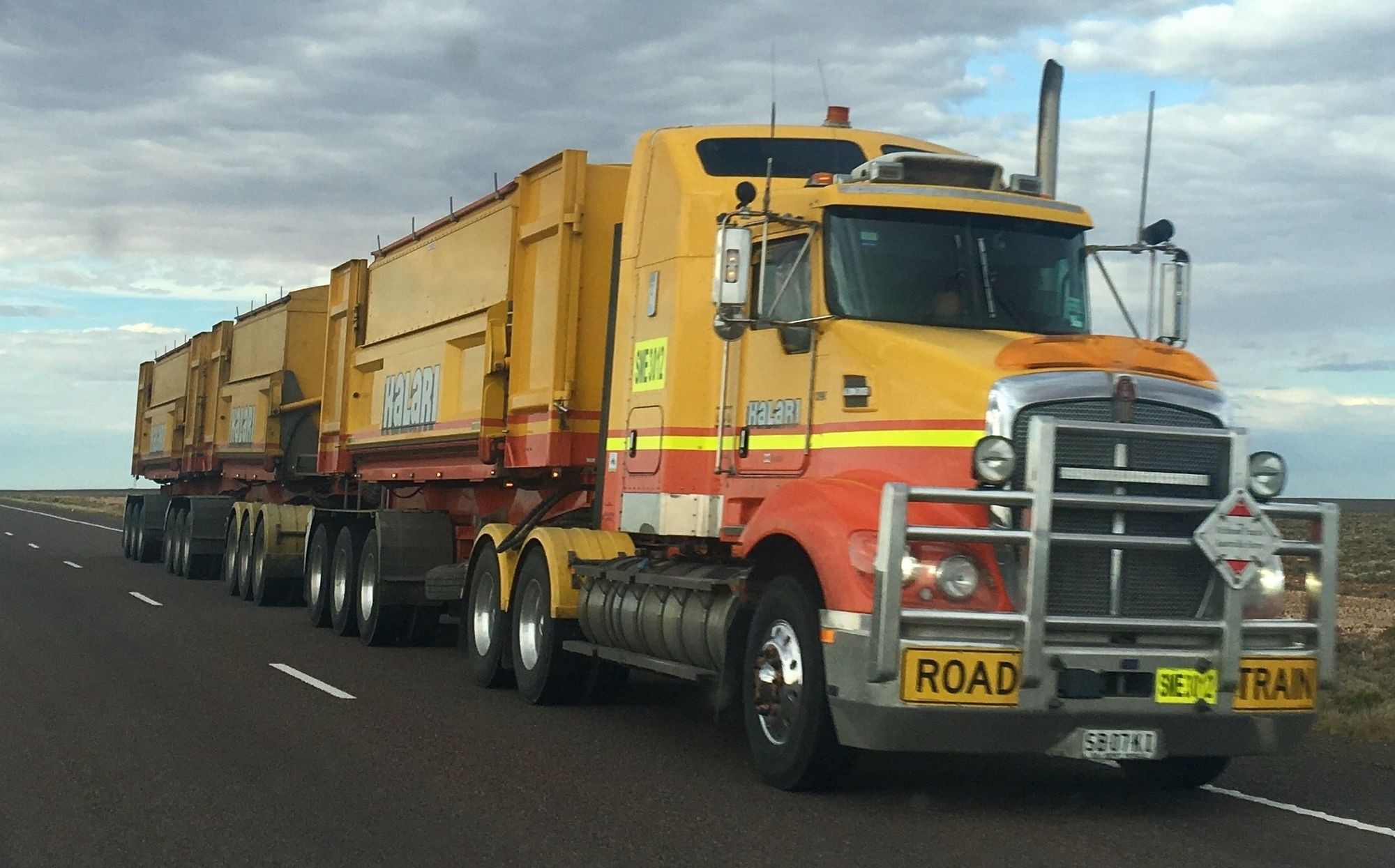 Yellow truck road train