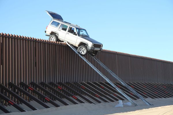 US Mexico border wall and truck
